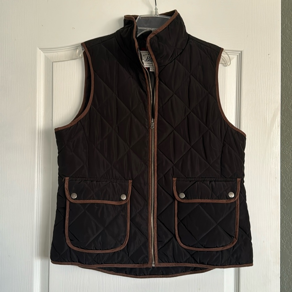 Black with brown trim quilted vest.